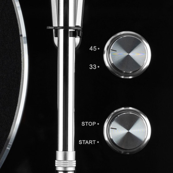 Detailed view of turntable knobs to select between 33 1/3 and 45 RPM 