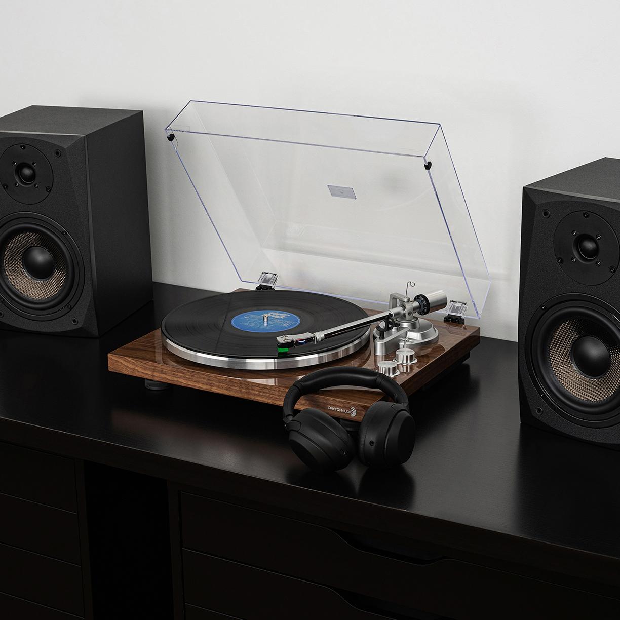 Dayton Audio Turntable Lifestyle Image with Bookshelf Speakers and Bluetooth Headphones