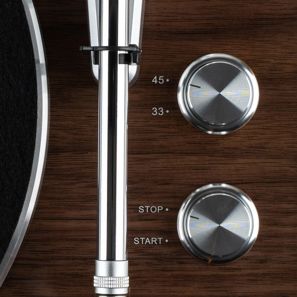 Detailed view of turntable knobs to select between 33 1/3 and 45 RPM 