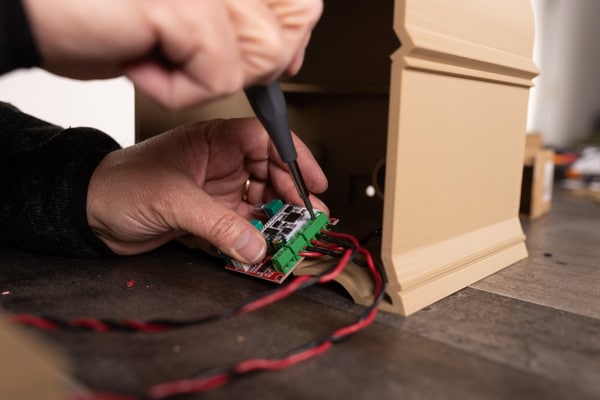 Close up shot of the amplifier being installed to the antique radio kit