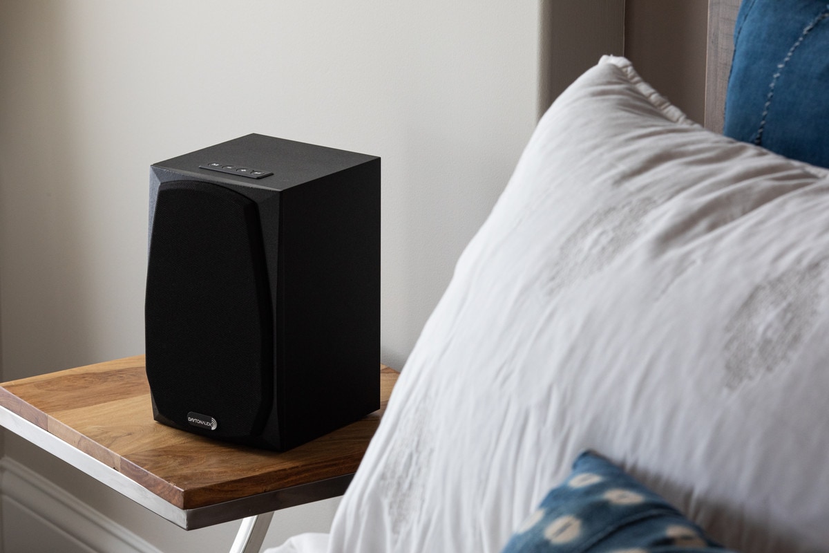 Dayton Audio MK Series Bluetooth speaker on a bedside table.