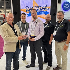 Jeff Stahl accepting an award for the DAX88 at InfoComm 2022.