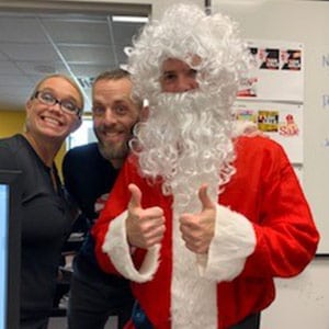 An employee dressed up as Santa Claus for a bit of holiday levity in the office.