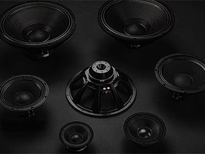 Woofers arranged on a black background.