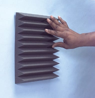 Image of step 3, acoustic foam mounted to the wall.