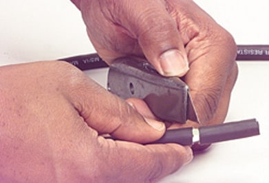 Using utility knife to cut outer insulation