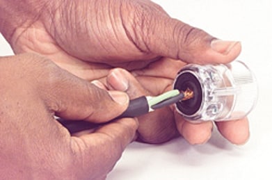 Inserting the cord end through the hosing base hole